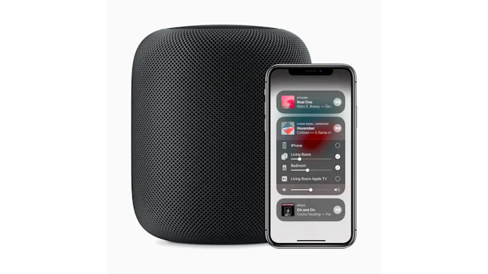 Apple iPhone met een zwarte HomePod.