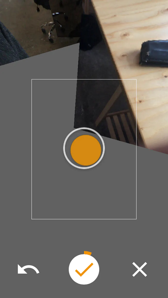 Zorg dat de oranje stip in de cirkel staat en wacht tot de app een foto heeft genomen.
